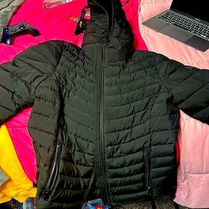 Calvin Klein black coat size kids large. Very comfortable and durable.